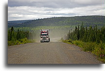 Truck is coming::Light drizzle reduced dust clouds that followed passing vehicles::