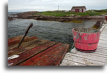 Knife Stuck into the Table::Small fishing wharf like many in southern Labrador::
